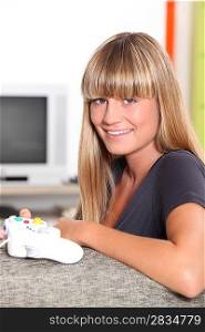 Blond teenage girl with video game controller