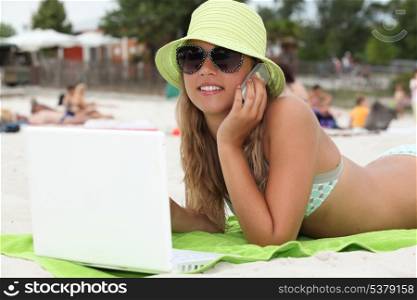 Blond teenager at the beach