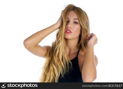 Blond teenager girl touching hair on white background
