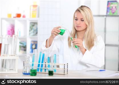 Blond teenager in science laboratory