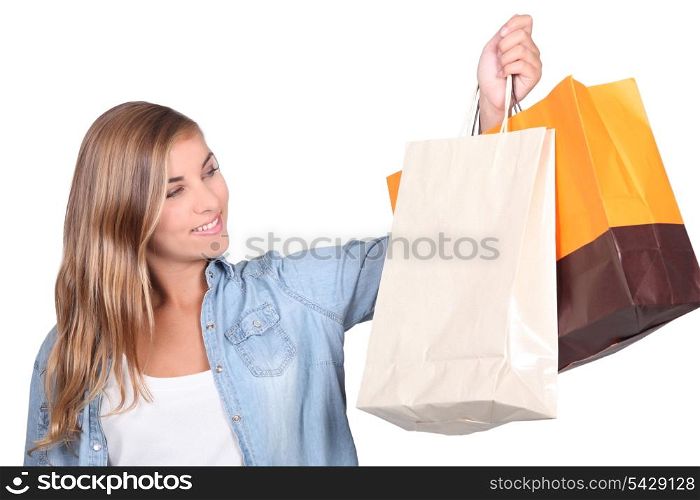 Blond teenager with shopping bags