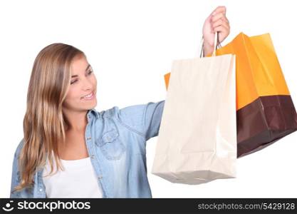 Blond teenager with shopping bags