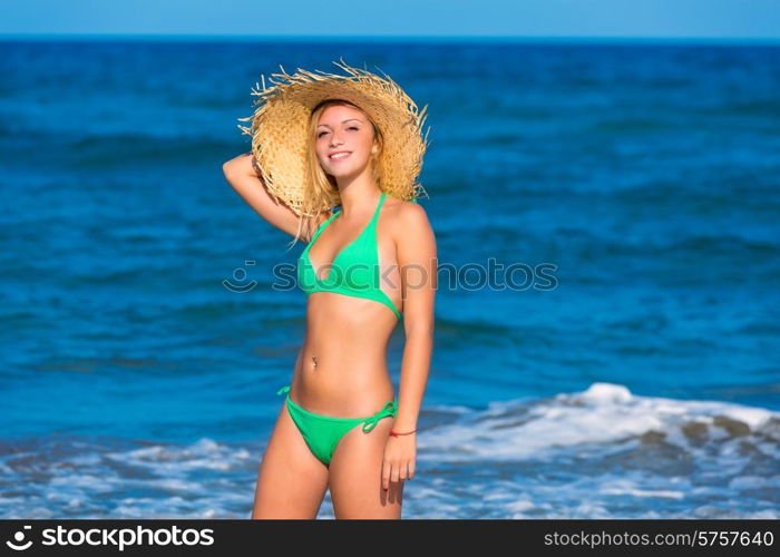 blond tourist girl in a tropical summer beach happy vacations