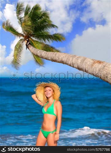 blond tourist girl in a tropical summer beach happy vacations Caribbean coconut palm tree