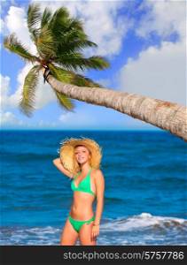 blond tourist girl in a tropical summer beach happy vacations Caribbean coconut palm tree