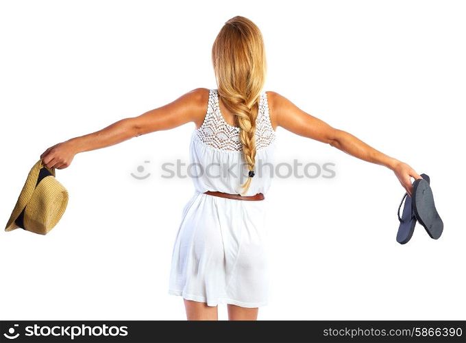 Blond tourist girl open arms with flip flop shoes white summer dress going beach rear view