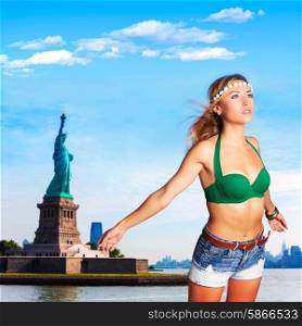 Blond tourist in Statue of Liberty with wind in hair New York photomount