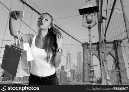 Blond tourist selfie photo in Brooklyn bridge New York photomount