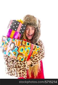 Blond winter kid girl with stacked presents smiling happy with fur hat