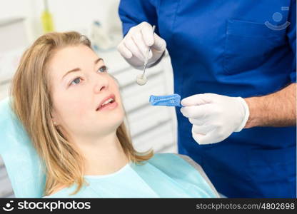 Blond woman at the dentist