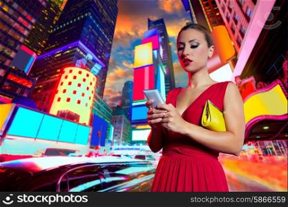 Blond woman chat writing smartphone inTimes Square New York at night Photomount