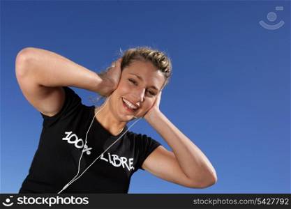 Blond woman covering ears