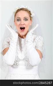 Blond woman dressed in wedding dress