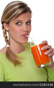 Blond woman drinking carrot juice on white background