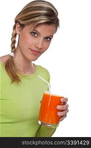 Blond woman holding carrot juice on white background