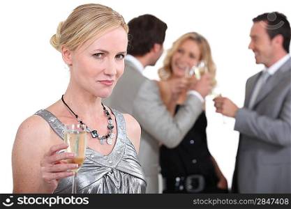 Blond woman holding up champagne