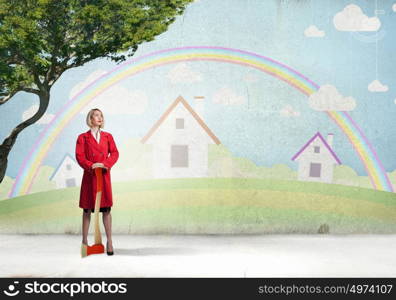 Blond woman in red coat with axe and green tree. Protect forests