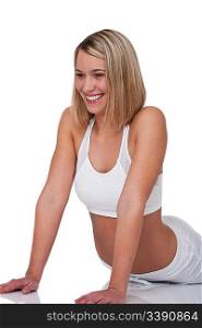 Blond woman in sportive outfit on white background