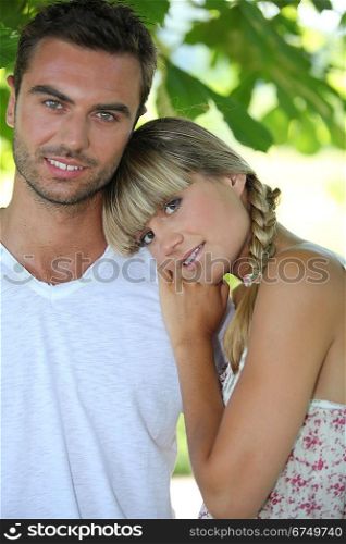 Blond woman leaning on man&acute;s shoulder