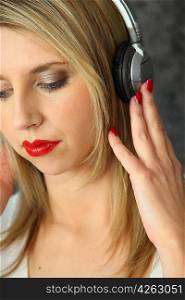 Blond woman listening to music