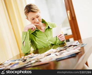 blond woman looking at photos