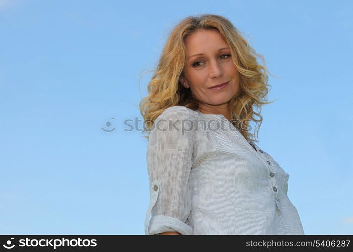 Blond woman looking down.