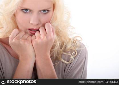 blond woman looking nervous