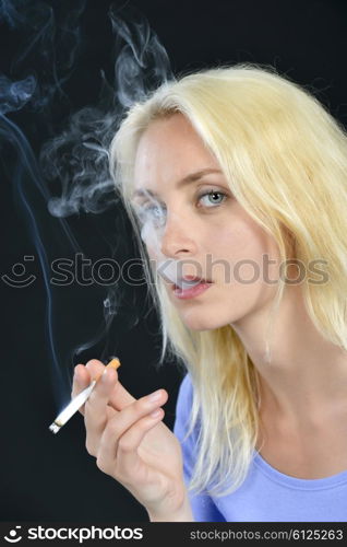 Blond woman smoking