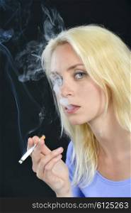 Blond woman smoking