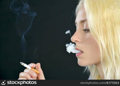 Blond woman smoking