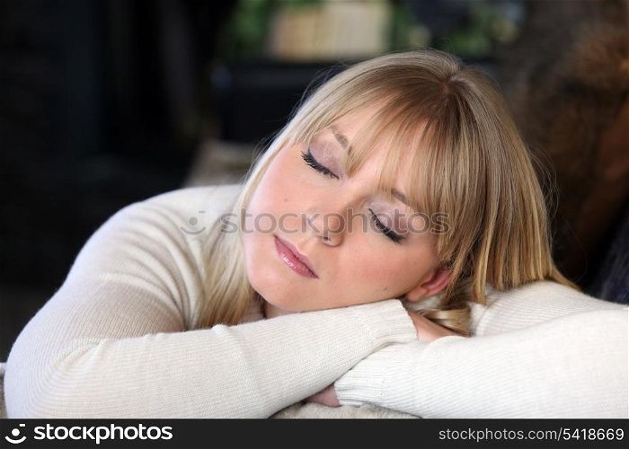Blond woman snoozing
