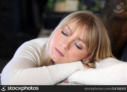 Blond woman snoozing