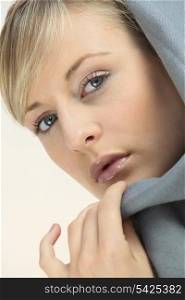 Blond woman wearing grey hood top