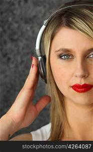 Blond woman wearing headphones