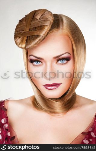 blond woman with beautiful blue eyes and hair around neck