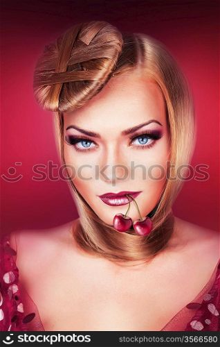 blond woman with blue eyes and cherry