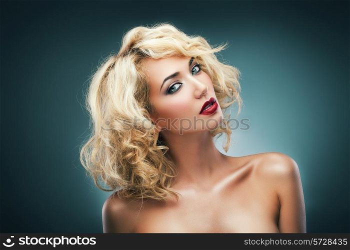 blond woman with curly hair and red lips