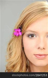 Blond woman with flower in her hair