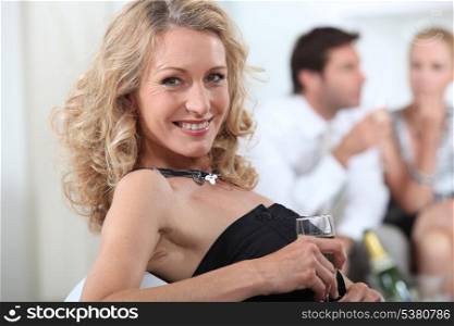 Blond woman with glass of champagne