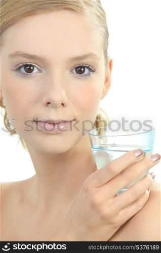 Blond woman with glass of water