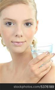 Blond woman with glass of water