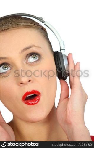 Blond woman with headphones audio