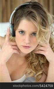 Blond woman with headphones audio