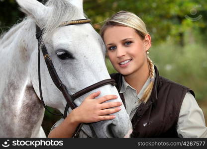 Blond woman with her horse