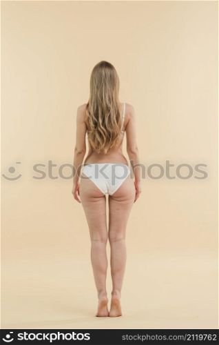blond woman with long hair wearing white lingerie