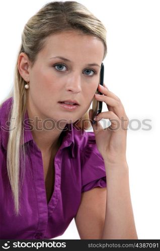 Blond woman with mobile telephone