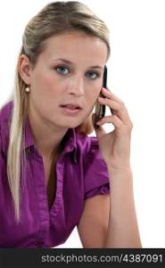Blond woman with mobile telephone