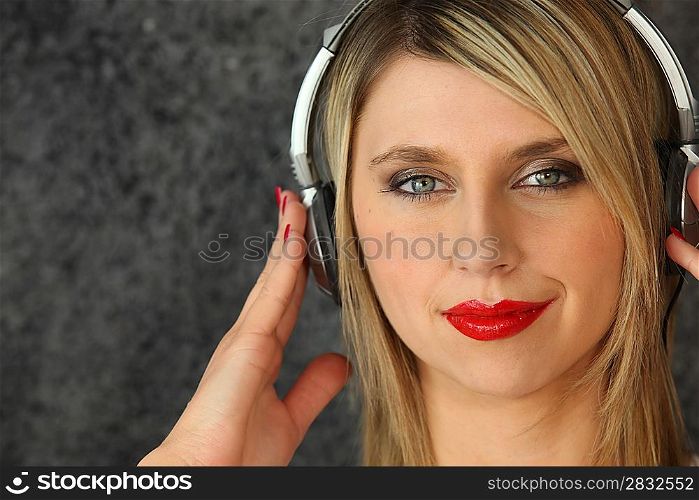 Blond woman with old-style headphones