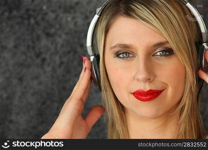 Blond woman with old-style headphones