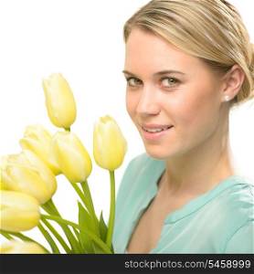 Blond woman with yellow tulips spring flowers isolated